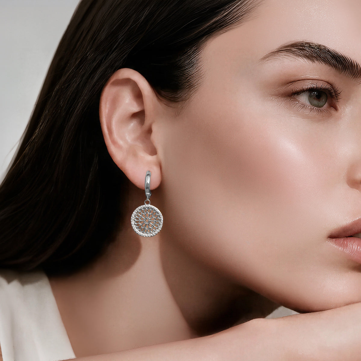 Notre Dame Rose Window Diamond Drop Earrings – White Gold, worn by a model
